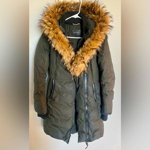 Mackage coat size Small in the color green. Moderately worn.
